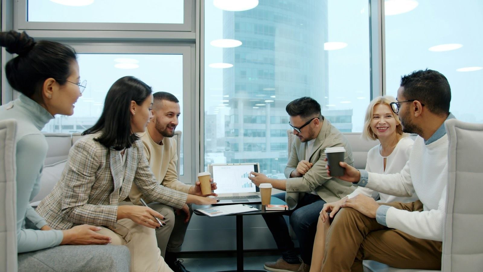 Tech Trend Innovation team discussing a project in a bright office